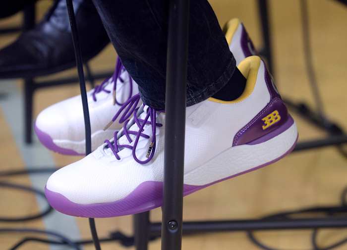 General view of white and purple shoes worn by Los Angeles Lakers player Lonzo Ball.
